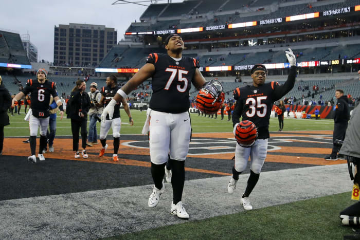 Dec 10, 2023; Cincinnati, Ohio, USA; Cincinnati Bengals offensive tackle Orlando Brown Jr. (75) and cornerback Jalen Davis (35) celebrate the win following the second half against the Indianapolis Colts at Paycor Stadium. Mandatory Credit: Joseph Maiorana-USA TODAY Sports